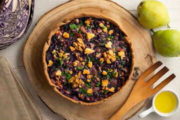 French quiche with red cabbage and vegetables. Traditional French recipe.