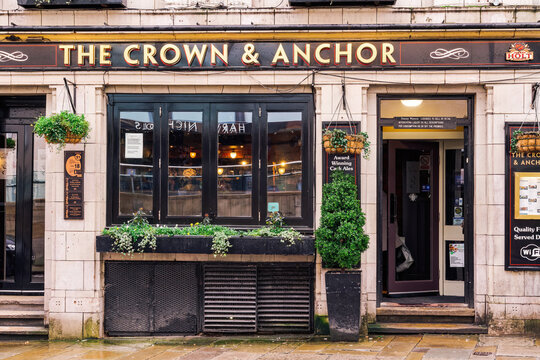 The Crown and Anchor pub facade with house-brand ales and comfort food in Manchester, UK, operated by the Joseph Holt Brewery.