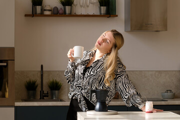 Relaxed woman with coffee, serene morning.