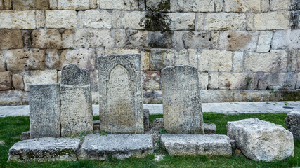 Ancient tombstones near the fortress wall. It is a monument of ancient Persian fortification...