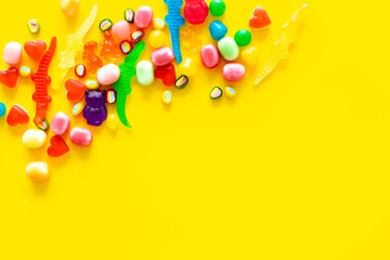 Food pattern. Sweets and candies background. Many different lollipops top view