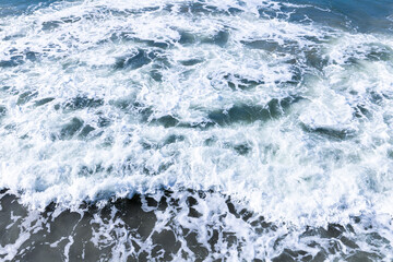 Sea water with waves and foam, abstract natural background photo