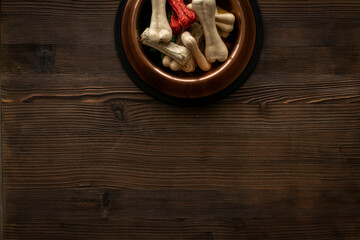 Food and treats for pets. Bowl full of dog chew bones