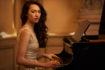 Mansion, woman and piano with portrait, home and pianist in a ballroom with luxury instrument....