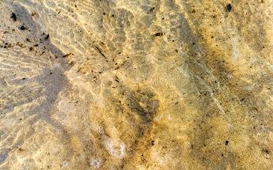 Small mini cenote cave at beach ocean with sand Mexico.