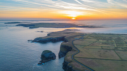 Aerial view - Rocky cliffs in Kilkee at sunrise, County Clare. Ireland.