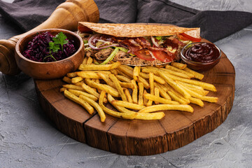 Delicious pita  with fries, sauces and additives