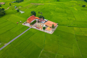 Wat yu at located middle of rice field with Rainy season, Nan province, Thailand.