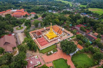 Beautiful Aerial View of Wat Phra That Chae Haeng and Golden stupa in Temple at Nan, Thailand.