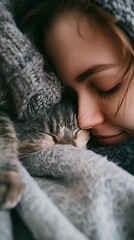 A close-up of a person cuddling with their pet, expressing love and companionship between humans and animals.