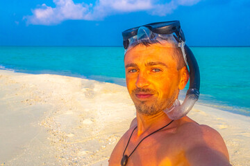 Man with snorkeling equipment fins and snorkeling mask Maldives.