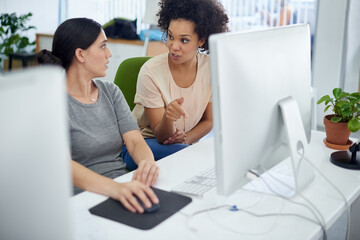 Businesswoman, partner and computer in office as team or web designer talking with digital...