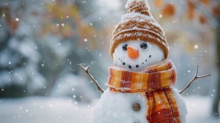 Snowman with a carrot nose, hat, scarf, coal buttons, and stick arms standing outside on a winter's day. Concept of winter, snow, and childhood. Shallow field of view.