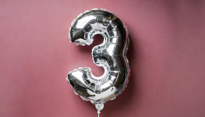 Banner with number 3 silver balloon. Three years anniversary celebration. Pink background.
