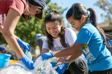 Global Day of Parents. a group of young girls are gathering trash together. Generative AI