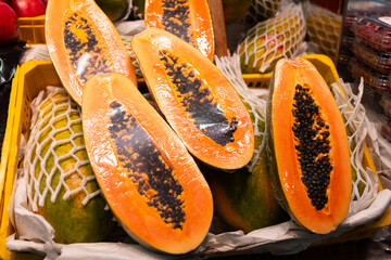 Fresh fruits on shelf in market. Healthy and food concept. Fresh papaya at farmer's market