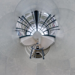 abstractly twisted into spherical 360 panorama interior of modern office with hall staircase and panoramic windows - 795389460