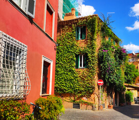 Fototapeta na wymiar Rome, Vibrant Colored Architecture, with the characteristic facade and windows in Trastevere 