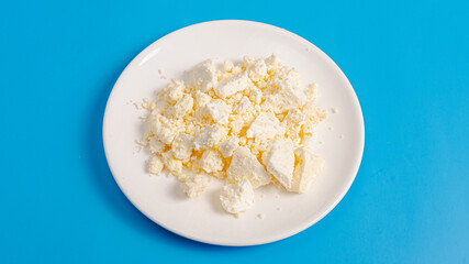 White cheese on plate isolated