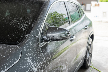 car cleaning and washing with foam soap - 795402867