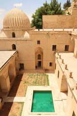View into the inner courtyard of the Sultan Isa Medrese, Madrasa, Zinciriye Medrese with its green...