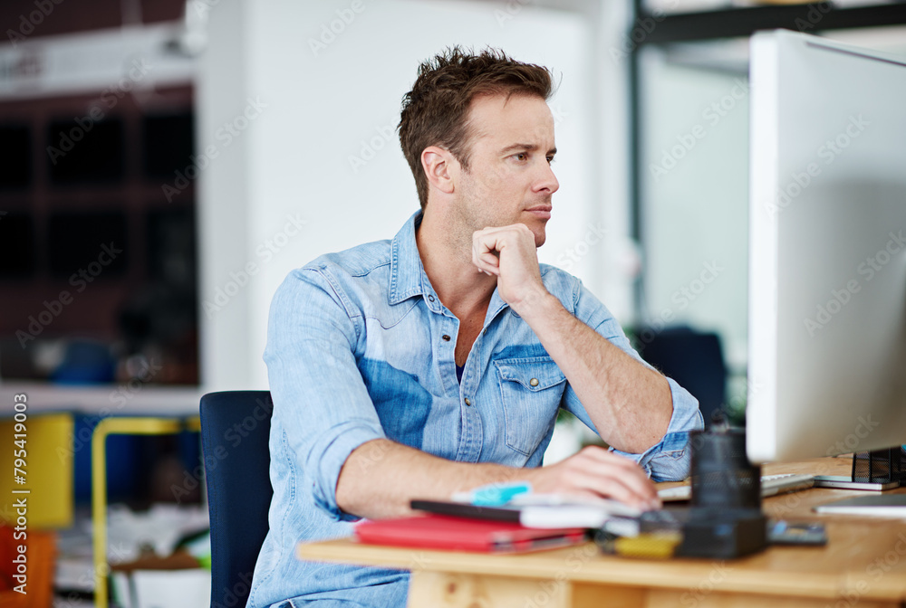 Poster Man, office and thinking on computer with research for creativity, designs and ideas for project as graphic designer. Employee, working and desktop in desk in startup business or agency with deadline