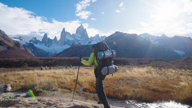 Hiker in Patagonia in Argentina with the iconic Fitz Roy mountains in the background, Patagonia, South America.
