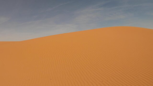 POV driving car through Erg Chebbi sand dunes of Sahara desert in southeastern Morocco