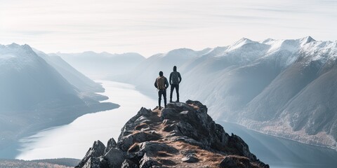 Iconic scene of two climbers standing proudly atop the summit, their outstretched arms and triumphant poses signaling the culmination of their arduous journey.