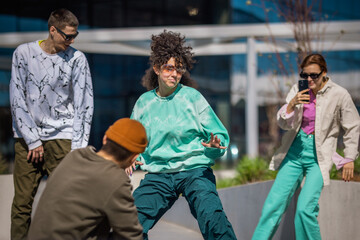 Vibrant Outdoor Scene Capturing A Young Woman With Curly Hair Dancing Energetically, Surrounded By...