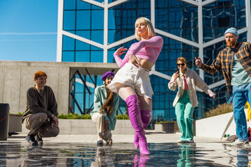 Vibrant Outdoor Scene Capturing A Diverse Group Of Young Adults Dancing Joyfully In Front Of A...