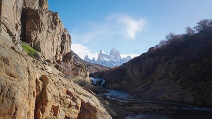 Mount Fitz Roy showing though secret waterfall in Patagonia Argentina, El Chalten town.
 - Powered by Adobe