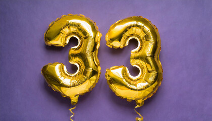 Banner with number 33 golden balloon. Thirty three years anniversary celebration. Bright purple background.