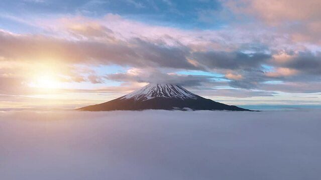 Aerial view of Mount Fuji with beautiful clouds over a clear sky and morning mist at sunrise. Japan's Mount Fuji