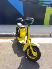 yellow scooter in the street