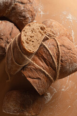 Selective focus home baked artisan ciabatta bread creative with ropes top view
