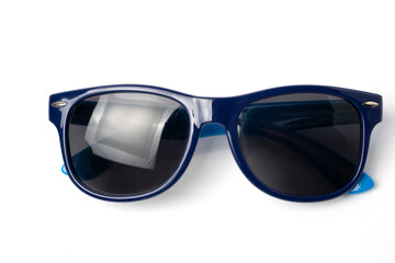 Blue sunglasses isolated on white background. Selective focus and shallow depth of field.