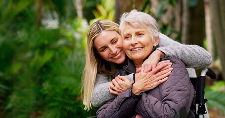 Wheelchair, senior and woman hug in park for retirement, rehabilitation and support. Person with disability, mother and daughter embrace in nature for healthcare, family care and mobility aid
