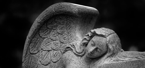Fototapeta premium Angel Sculpture with Wings Representing Love Faith and Peace Spirit