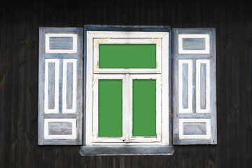 Wooden rustic window in cottage house. Rusty architecture. Wood home wall facade. Decorative shutters. Dark wood. Village farm building. Green screen interior. Empty blank glass. Blue peeling paint.