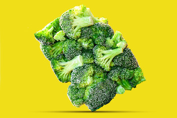 fresh broccoli stands on edge. Frozen Organic broccoli florets in a rectangular shape in one piece...