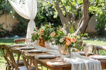 A table with a white tablecloth and a white table runner. The table is set with a variety of flowers and vases, and there are several chairs around the table - obrazy, fototapety, plakaty