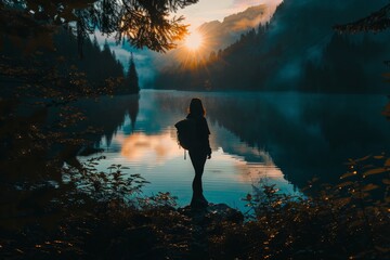 A solo traveler traveling to a lake between the forest - obrazy, fototapety, plakaty