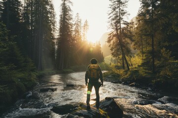 A solo traveler traveling in a river between the forest - obrazy, fototapety, plakaty
