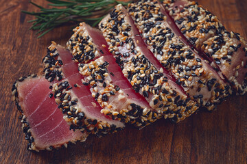 fillet of red tuna meat, fried in sesame seeds, homemade, close-up, no people,