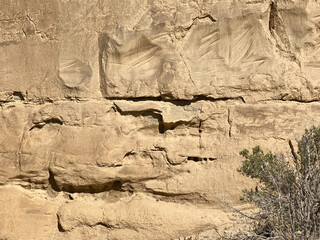 Early graffiti marked 1887 at Chaco Culture National Historical Park in New Mexico. Chaco Canyon was a major Ancestral Puebloan culture center and has many pueblos. Petroglyph trail.