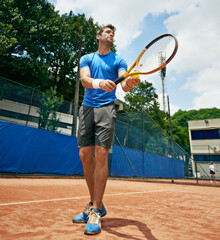 Man, sports and serve in outdoor tennis match, game and court for competition or practice. Male...