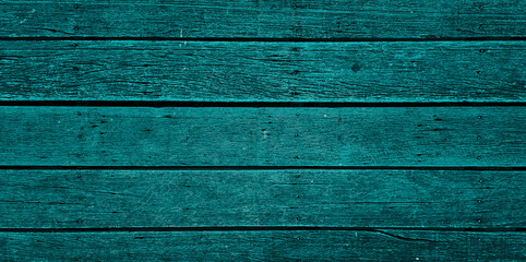 green old monochrome wooden deck flooring background showing wood grain, nails. abstract dark green timber wood oak panels used as background with blank space for design. outdoor wooden floor.