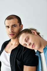 Two men standing side by side in affectionate unity.