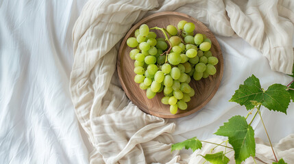 Bunch of grapes on wooden plate